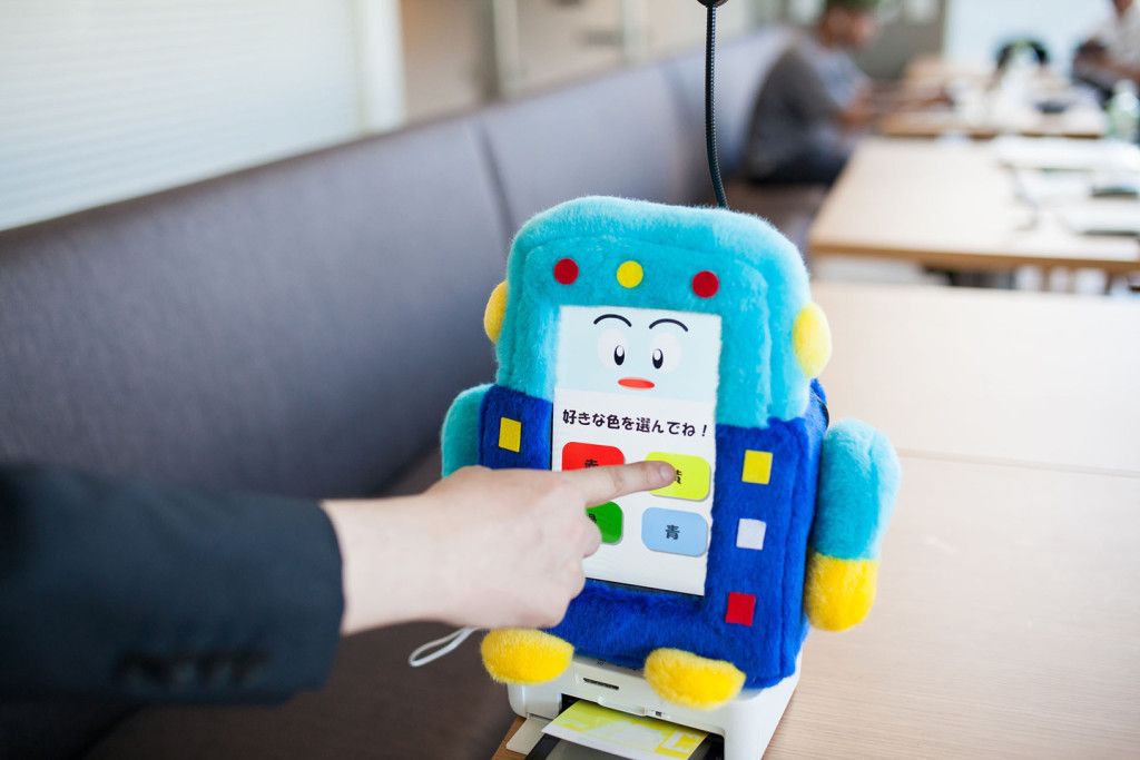 SASEBO, JAPAN - JULY 15: A small robot in the lobby designed to entertain waiting guests will print out photos on the spot at the Henna Hotel (Weird Hotel) in Huis Ten Bosch, Netherlands themed amusement park on July 15, 2015 in Sasebo, Japan. The Henna Hotel, scheduled to open on July 17, features multi-lingual humanoid robots that greet visitors while other robots serve coffee and do the cleaning, as well as room doors that are opened by face-recognition technology.  (Photo by Trevor Williams/WireImage)