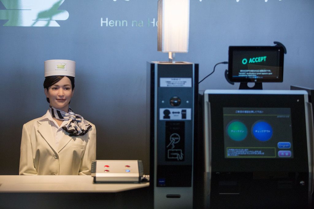 SASEBO, JAPAN - JULY 15: Guests check in via a completely automated system including a humanoid robot at the Henna Hotel (Weird Hotel) in Huis Ten Bosch, Netherlands themed amusement park on July 15, 2015 in Sasebo, Japan. The Henna Hotel, scheduled to open on July 17, features multi-lingual humanoid robots that greet visitors while other robots serve coffee and do the cleaning, as well as room doors that are opened by face-recognition technology.  (Photo by Trevor Williams/WireImage)