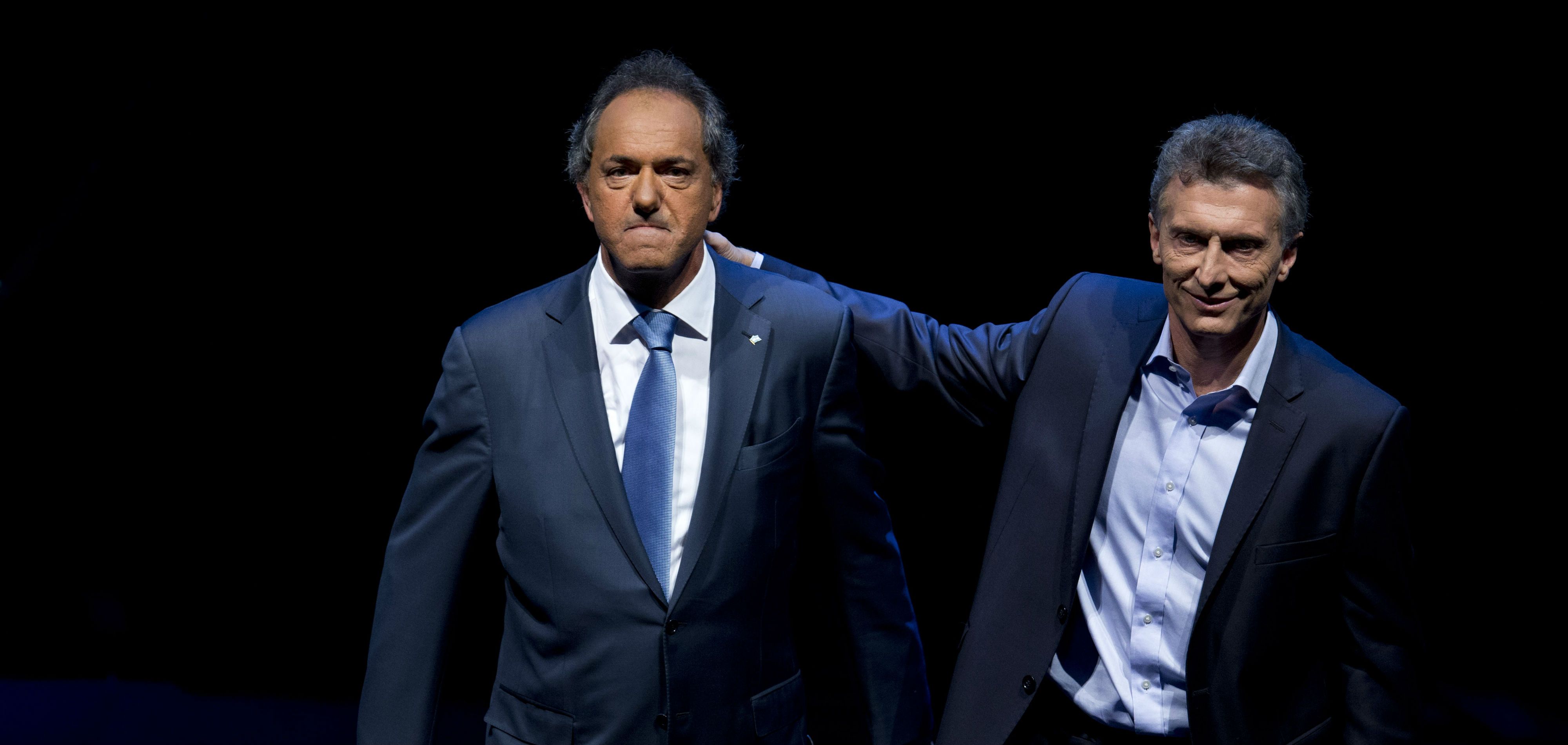 Macri y Scioli se enfrentan en las urnas Macri y Scioli se enfrentan en las urnas