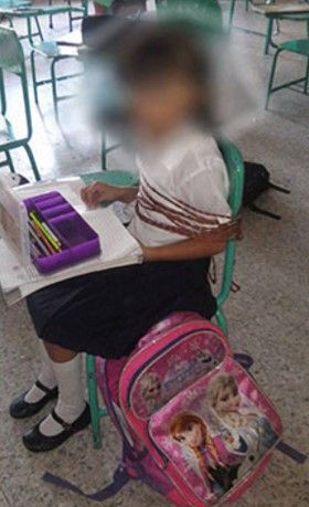 Encuentran a niña amarrada en pupitre de escuela primaria - niña-amarrada-internet