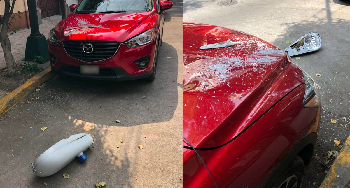 Cae lámpara y se estrella contra cofre de camioneta en la Miguel Hidalgo