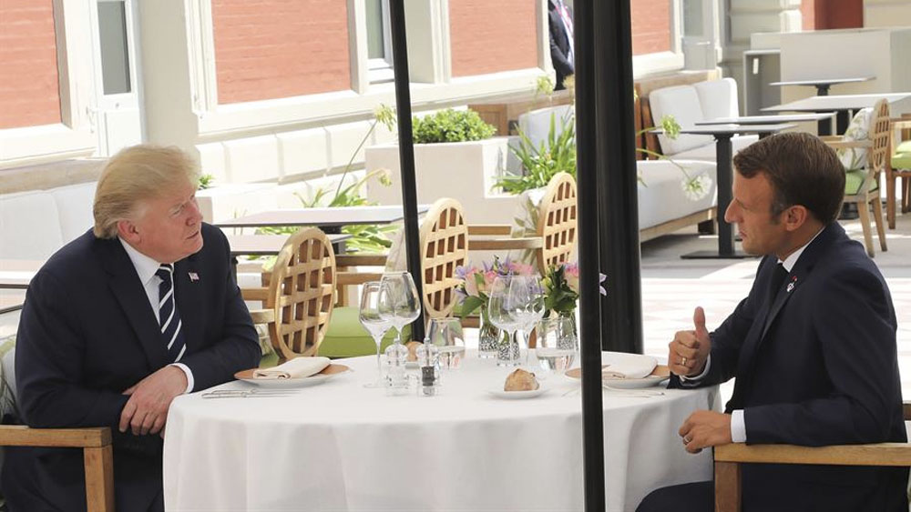 Macron y Trump se reúnen previo a cumbre del G7