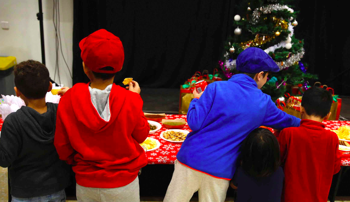 Refugiados celebran Navidad en Madrid
