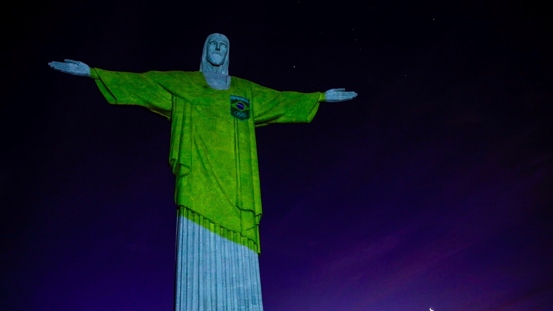 El Cristo Redentor se tiñe de verde y amarillo por los 100 días de Tokio 2020
